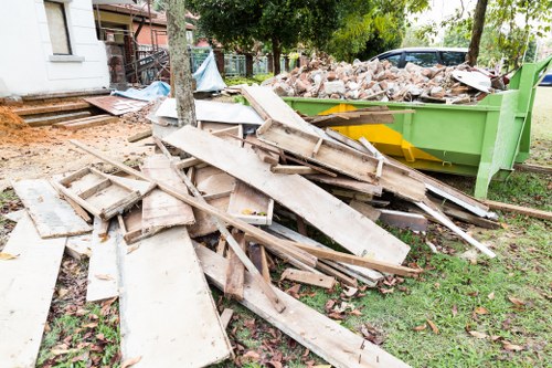 Auditor speaking with workers during a compliance check in a property clearance project